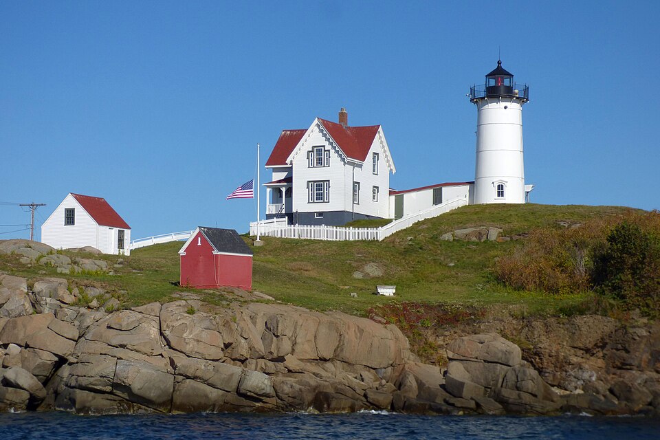 Cape Neddick Light — the Nubble lighthouse — on its rocky island off York, Maine, seen from the water